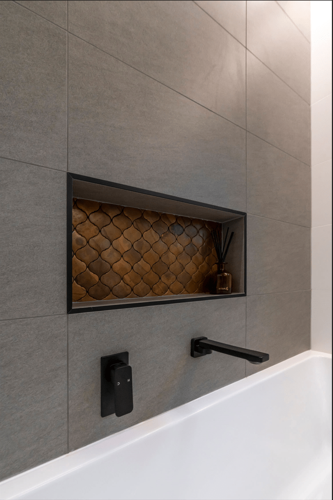 New bathtub installation with tiled surround and modern fixtures. Toronto bathroom renovation